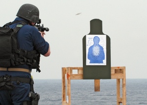 From Wikipedia: "PACIFIC OCEAN (Feb. 4, 2008) A member of the visit, board, search and seizure (VBSS) security force aboard the amphibious dock landing ship USS Harpers Ferry (LSD 49) fires his weapon on the firing range during a target practice drill. The VBSS team is training on various weapons and boarding procedures to enhance their proficiency skills when boarding and searching vessels. U.S. Navy photo by Mass Communication Specialist 2nd Class Joshua J. Wahl (Released)"